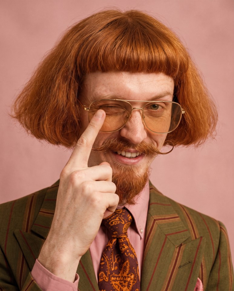 Close-up of Tony winking behind his gold aviator glasses